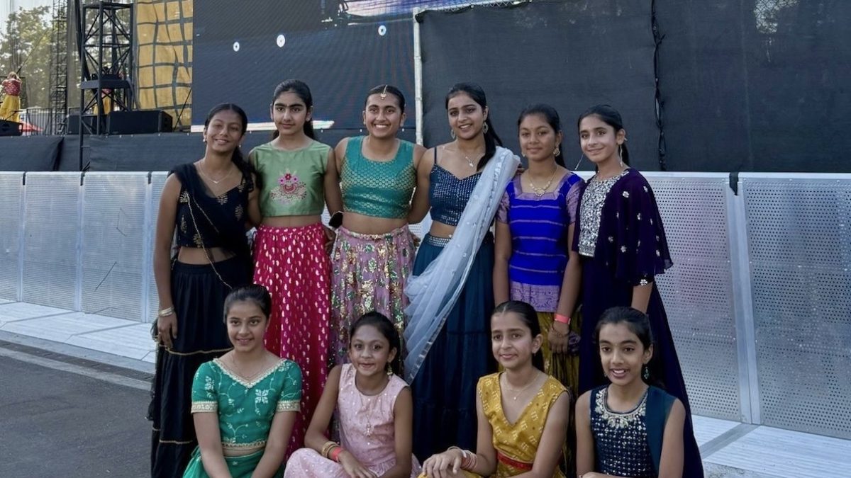 Juniors Yashica Gupta and Gia Phatarphekar pose with their dance students following a performance at the Great Park Diwali Celebration. “We were really excited that we got into that and seeing our girls perform for so many people, which [made us] really proud,” Phatarphekar said.