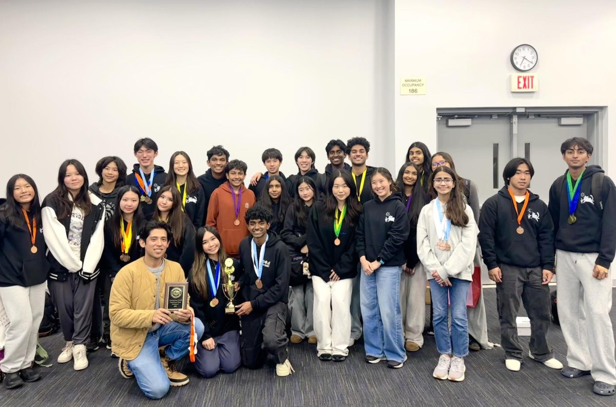 The Science Olympiad team gathers for a group photo at the University of Irvine, California after the Orange County Regionals. “This year, what was different was that we had a lot more invitationals that we went to,” Science Olympiad adviser Christian Quinteros said. “The kids actually got to see how they would do in an actual competition before we went to regionals, which is really good for them. They got a reality check, where they're like, ‘Oh, we didn't place as well as we thought we were going to,’ which is good because it happened really early in the school year. They’re able to adjust and study and build.” 
