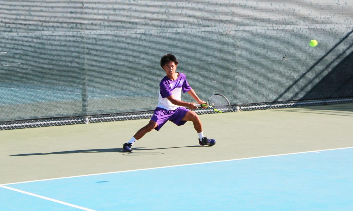 Co-captain and junior Anthony Nguyen prepares for a return during his singles match against Irvine High. “The team played really good,” Nguyen said. “We held our ground. [Even] though the conditions are a little rough, we all played pretty well and we pushed through.”