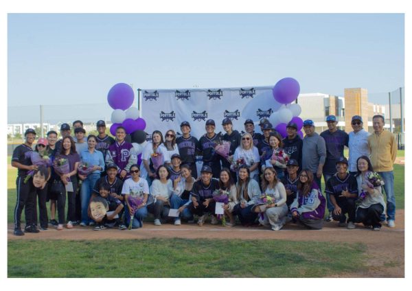 Senior families gather together for a photo after the conclusion of the game and senior ceremonies. “Just being around them, we practice every day during the school year, just having my best friends, the guys on the team, is just really special,” shortstop and senior Nico Atencio said. “We have a special bond, and it makes playing with the team a lot better.”